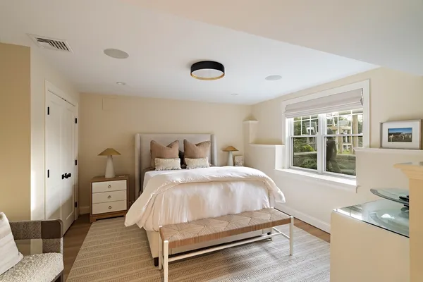 a bedroom with a bed and window