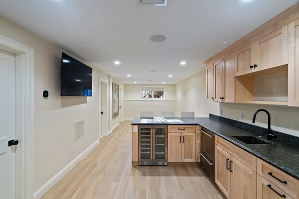 a kitchen with a sink stove and cabinets