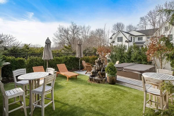 a view of a patio with table and chairs and potted plants