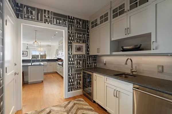 a kitchen with granite countertop a sink and cabinets