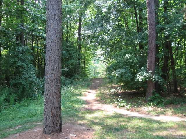 1355 Springlawn Court Raleigh, NC 27609 - Photo 11 of 12 Path at side leading to Shelly Lake