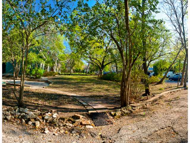 1700 Pease Road Austin, TX 78703 - Photo 1 of 1 a view of a yard with wooden fence