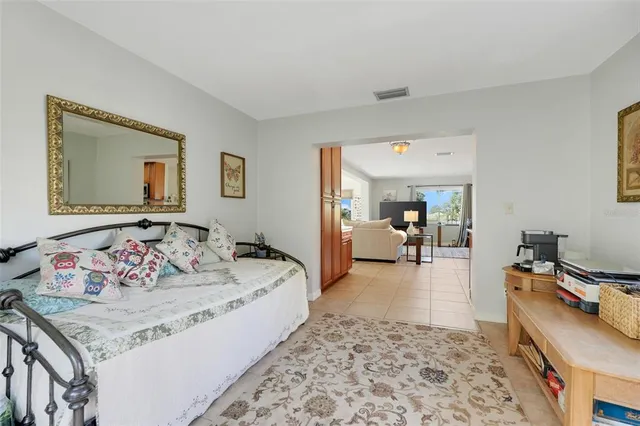 a bedroom with a bed and a couch