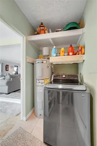 a view of a hallway with bathroom and a sink