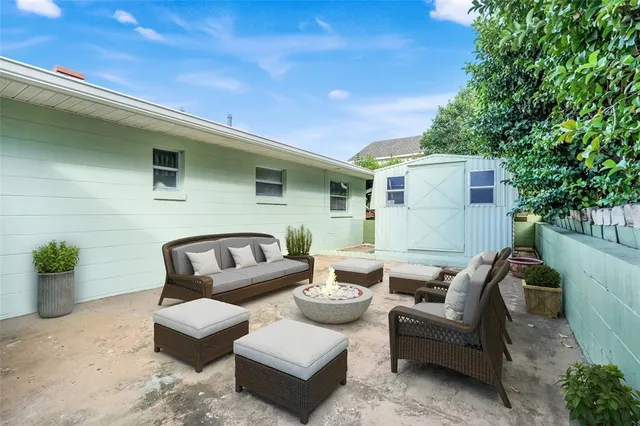 a view of a house with a backyard