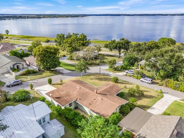 a view of a swimming pool with a yard