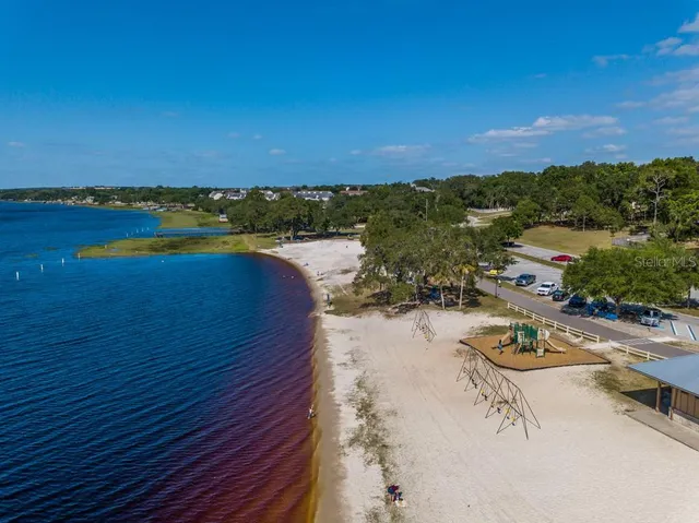 a view of a swimming pool with a lounge chairs