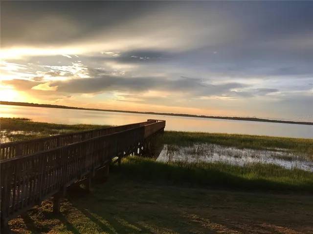 a balcony with wooden floor