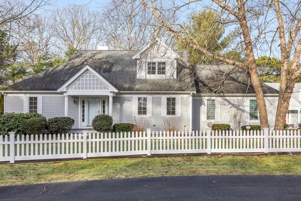 91 Reflection Drive Sandwich, MA 02563 - Photo 1 of 42 a front view of a house with a garden
