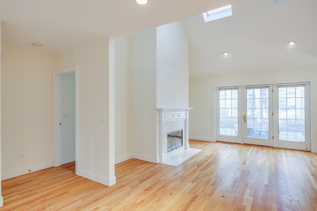 91 Reflection Drive Sandwich, MA 02563 - Photo 18 of 42 a view of an empty room with wooden floor and a window