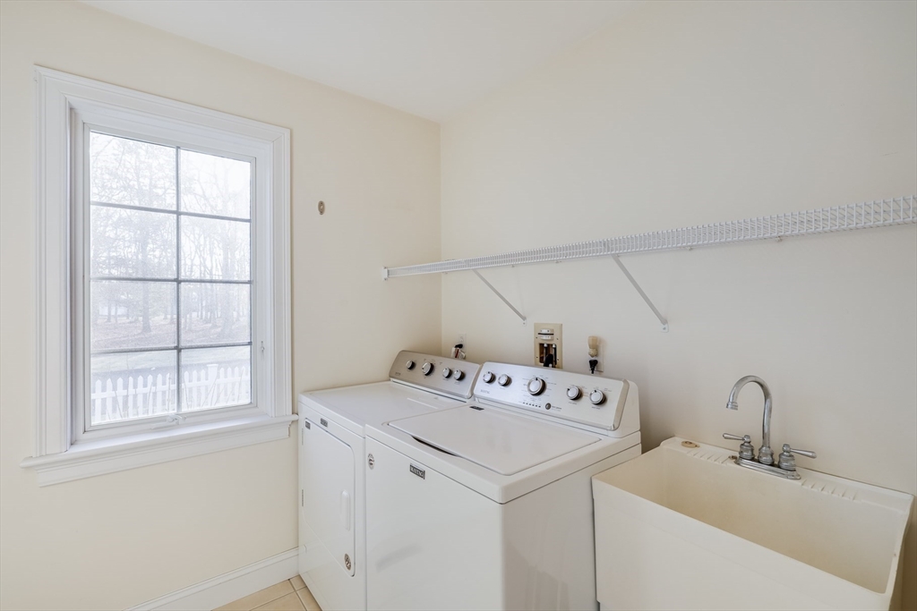 91 Reflection Drive Sandwich, MA 02563 - Photo 24 of 42 a utility room with cabinets washer and dryer