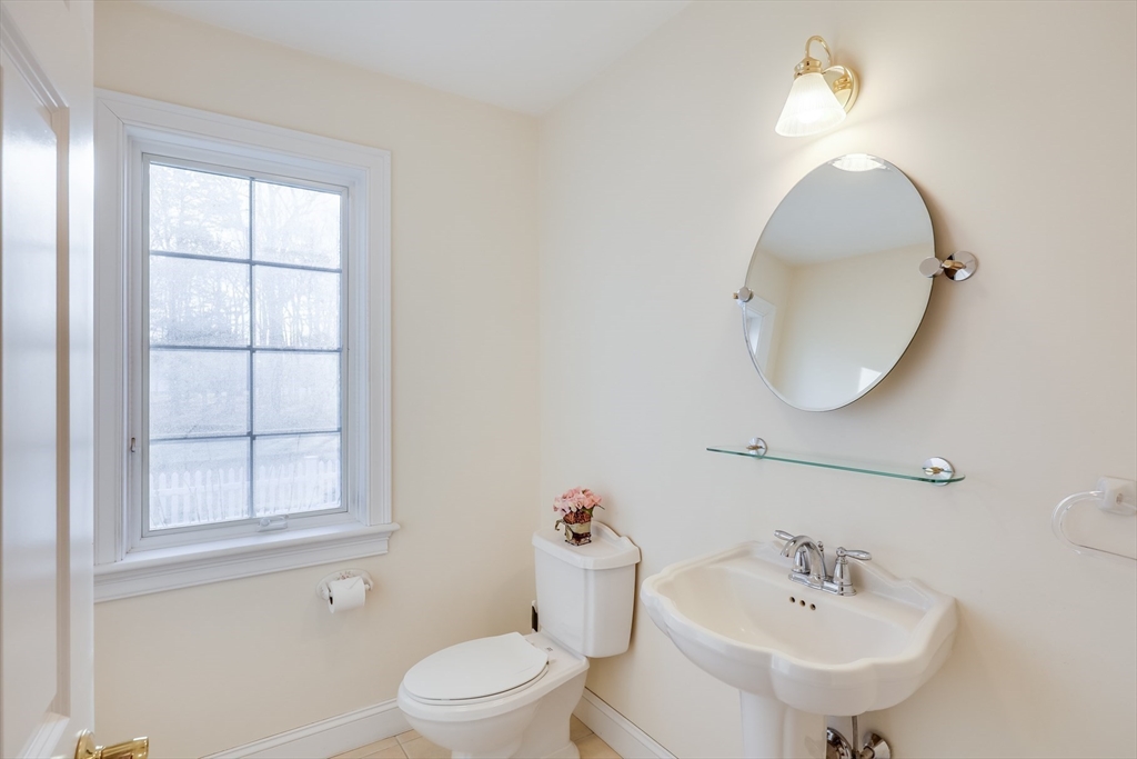 91 Reflection Drive Sandwich, MA 02563 - Photo 25 of 42 a bathroom with a sink a toilet and a mirror