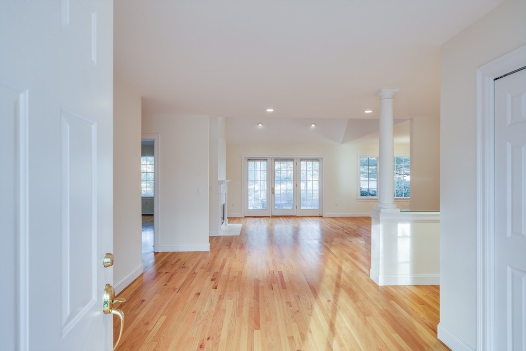 91 Reflection Drive Sandwich, MA 02563 - Photo 3 of 42 a view of an empty room and wooden floor