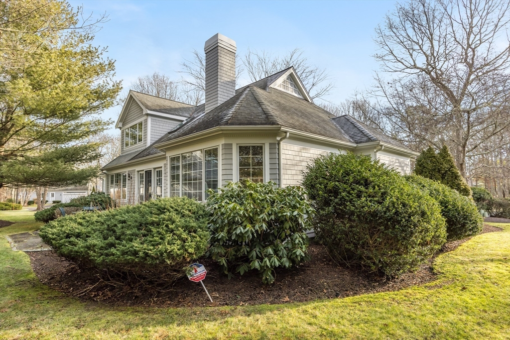 91 Reflection Drive Sandwich, MA 02563 - Photo 33 of 42 a front view of a house with a yard
