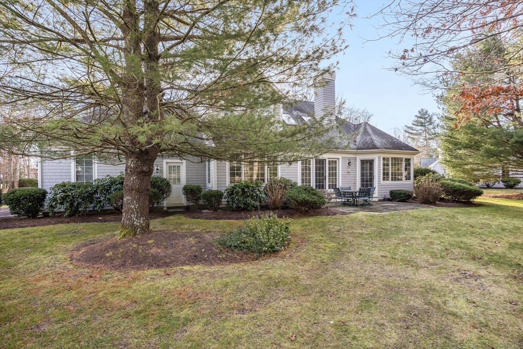91 Reflection Drive Sandwich, MA 02563 - Photo 34 of 42 a front view of a house with garden