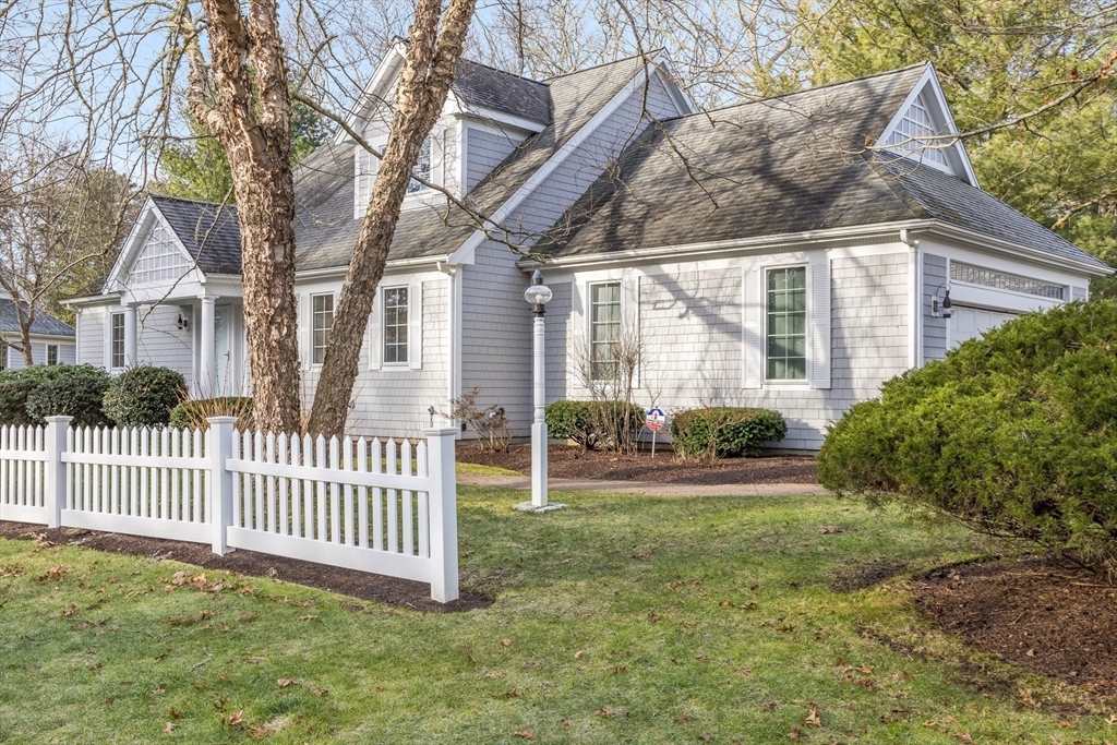 91 Reflection Drive Sandwich, MA 02563 - Photo 37 of 42 a front view of a house with garden