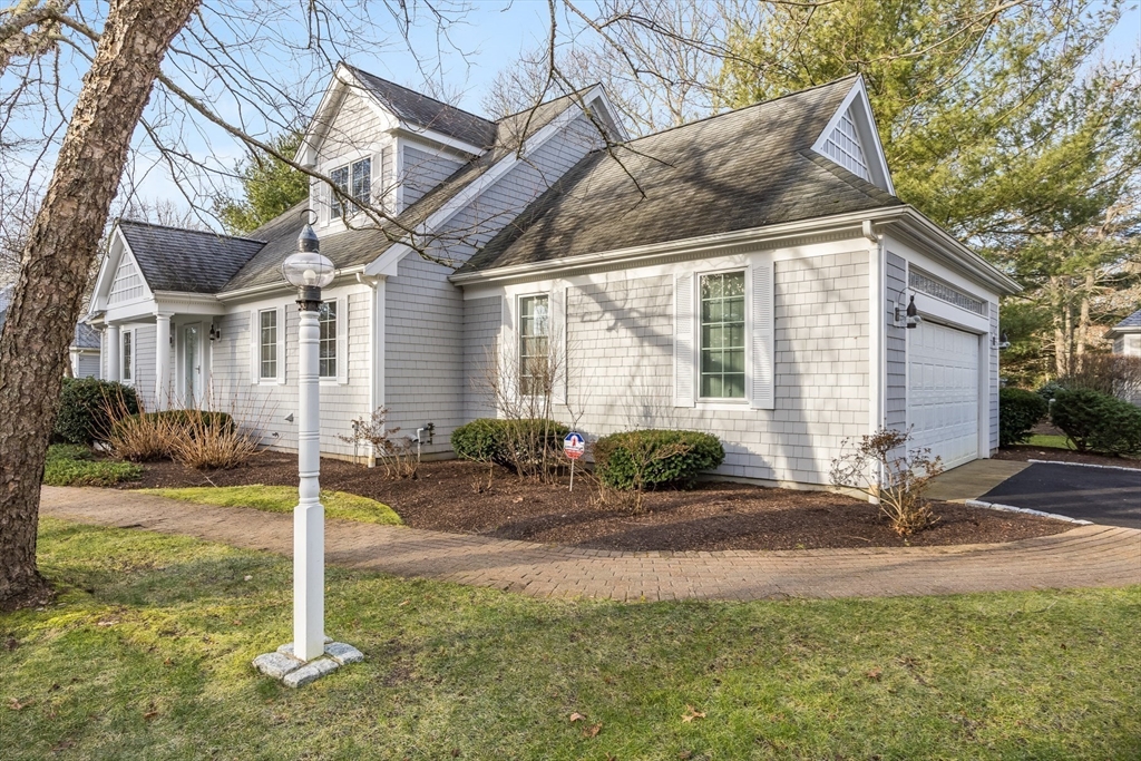 91 Reflection Drive Sandwich, MA 02563 - Photo 38 of 42 a front view of a house with garden