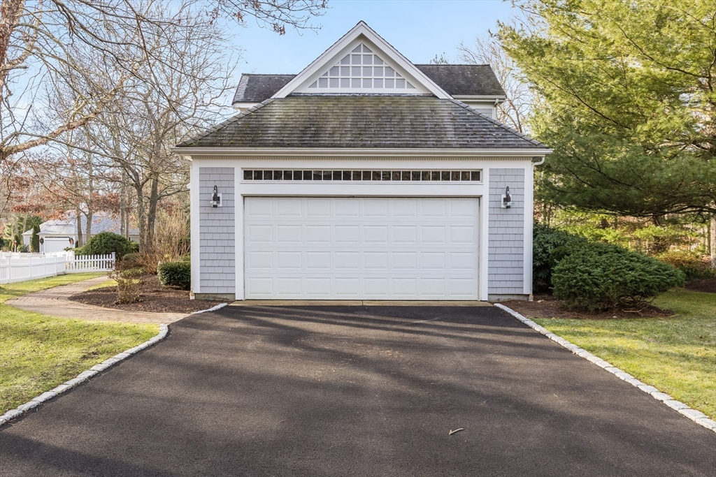 91 Reflection Drive Sandwich, MA 02563 - Photo 39 of 42 a front view of a house with a yard