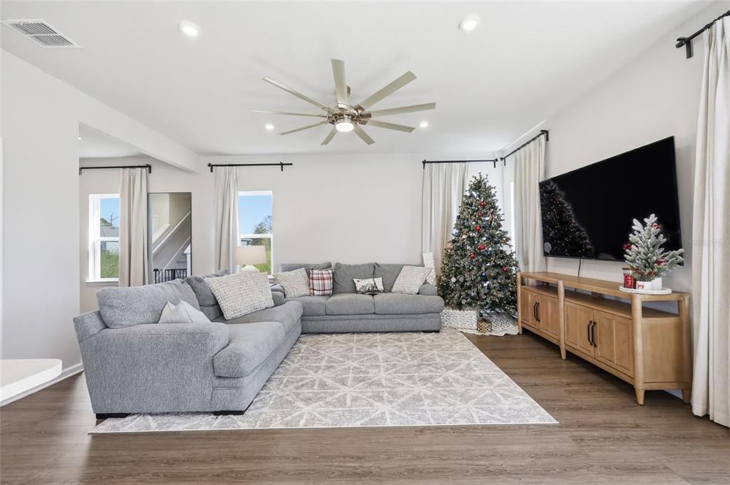 5000 Bear Lake Loop DeLand, FL 32724 - Photo 12 of 45 a living room with furniture and a flat screen tv