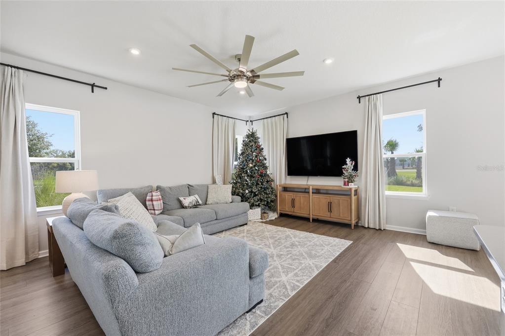 5000 Bear Lake Loop DeLand, FL 32724 - Photo 13 of 45 a living room with furniture and a flat screen tv