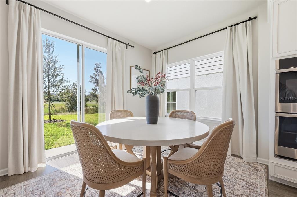 5000 Bear Lake Loop DeLand, FL 32724 - Photo 16 of 45 a dining room with furniture and window