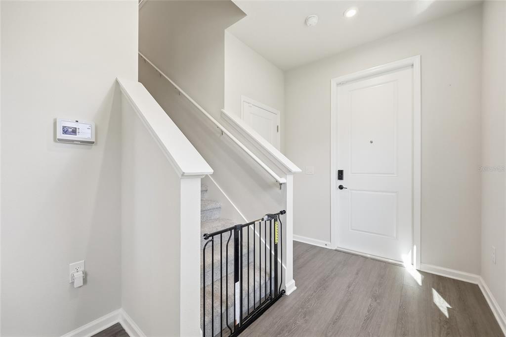 5000 Bear Lake Loop DeLand, FL 32724 - Photo 20 of 45 a view of a hallway with wooden floor and entryway