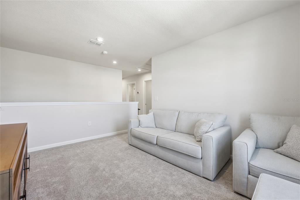 5000 Bear Lake Loop DeLand, FL 32724 - Photo 24 of 45 a living room with furniture and a couch