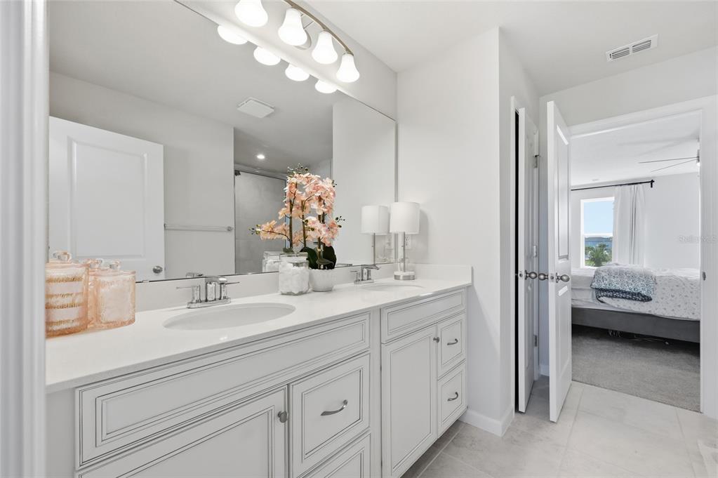 5000 Bear Lake Loop DeLand, FL 32724 - Photo 29 of 45 a en suite bathroom with a double sink and mirror