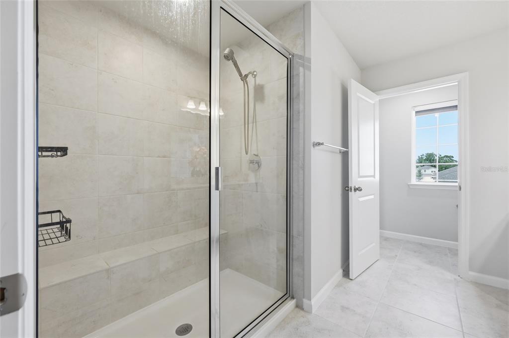 5000 Bear Lake Loop DeLand, FL 32724 - Photo 30 of 45 a bathroom with a glass shower door