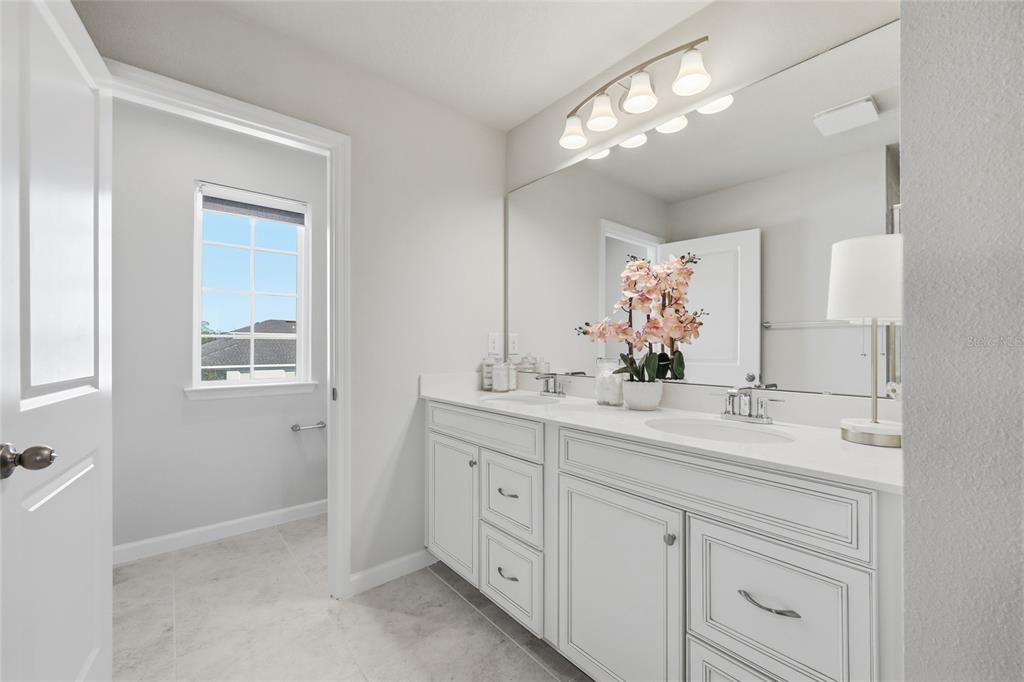 5000 Bear Lake Loop DeLand, FL 32724 - Photo 31 of 45 a bathroom with a double vanity sink mirror and