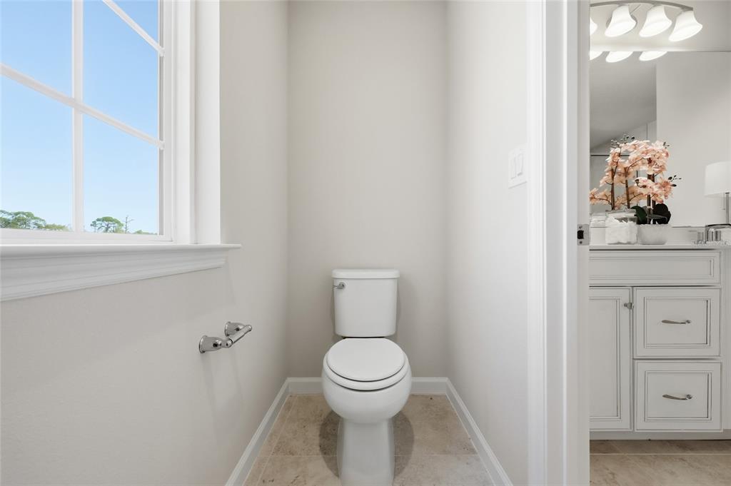 5000 Bear Lake Loop DeLand, FL 32724 - Photo 32 of 45 a bathroom with a toilet a sink and a window
