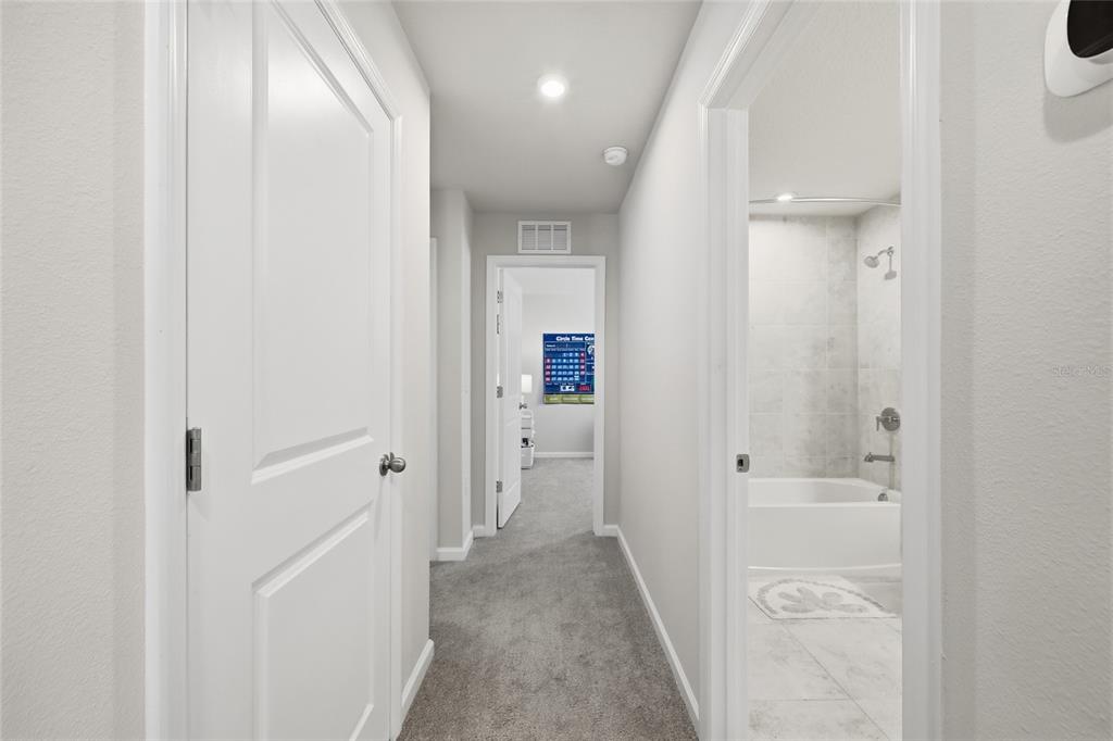 5000 Bear Lake Loop DeLand, FL 32724 - Photo 33 of 45 a view of a hallway with wooden floor