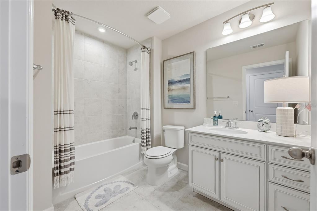 5000 Bear Lake Loop DeLand, FL 32724 - Photo 34 of 45 a spacious bathroom with a bathtub shower sink mirror and toilet