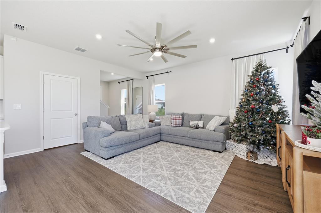 5000 Bear Lake Loop DeLand, FL 32724 - Photo 9 of 45 a living room with furniture and a potted plant