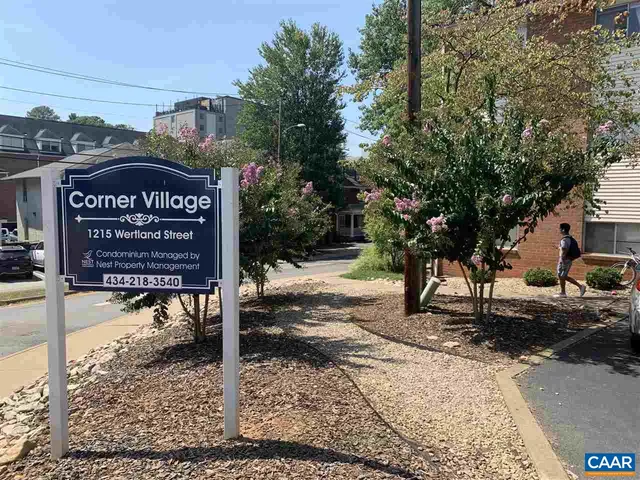 a view of a street with benches