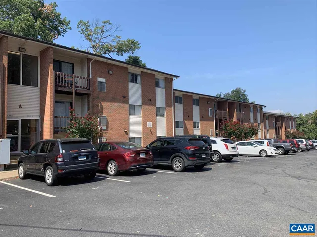 a view of a car parked in front of a house