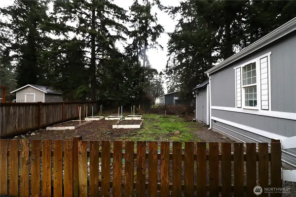 a view of wooden fence and a trees