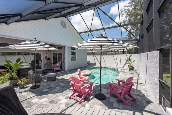 a view of a chairs and table in the patio