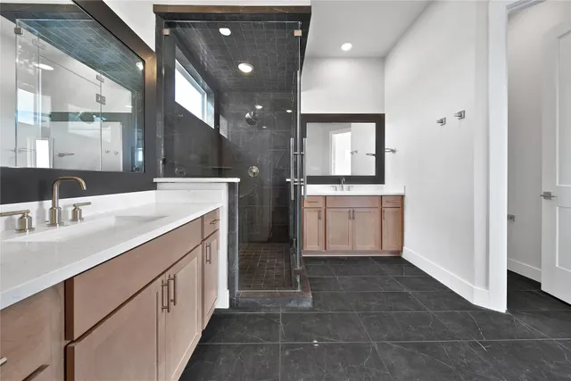 a bathroom with a sink vanity and mirror