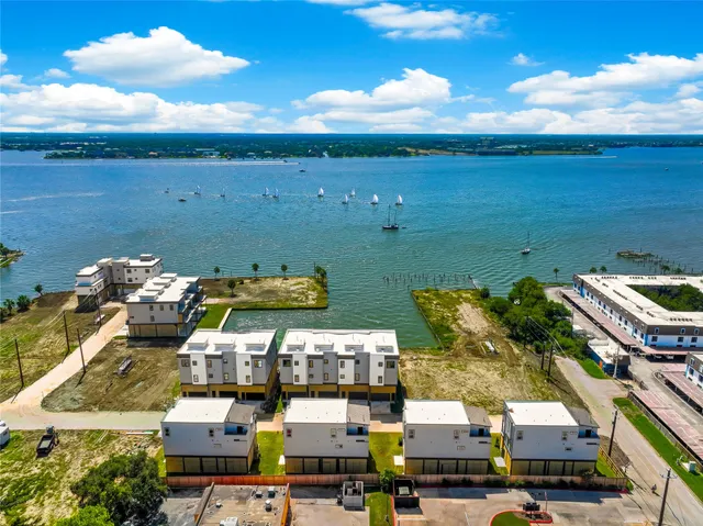 an aerial view of a houses with outdoor space