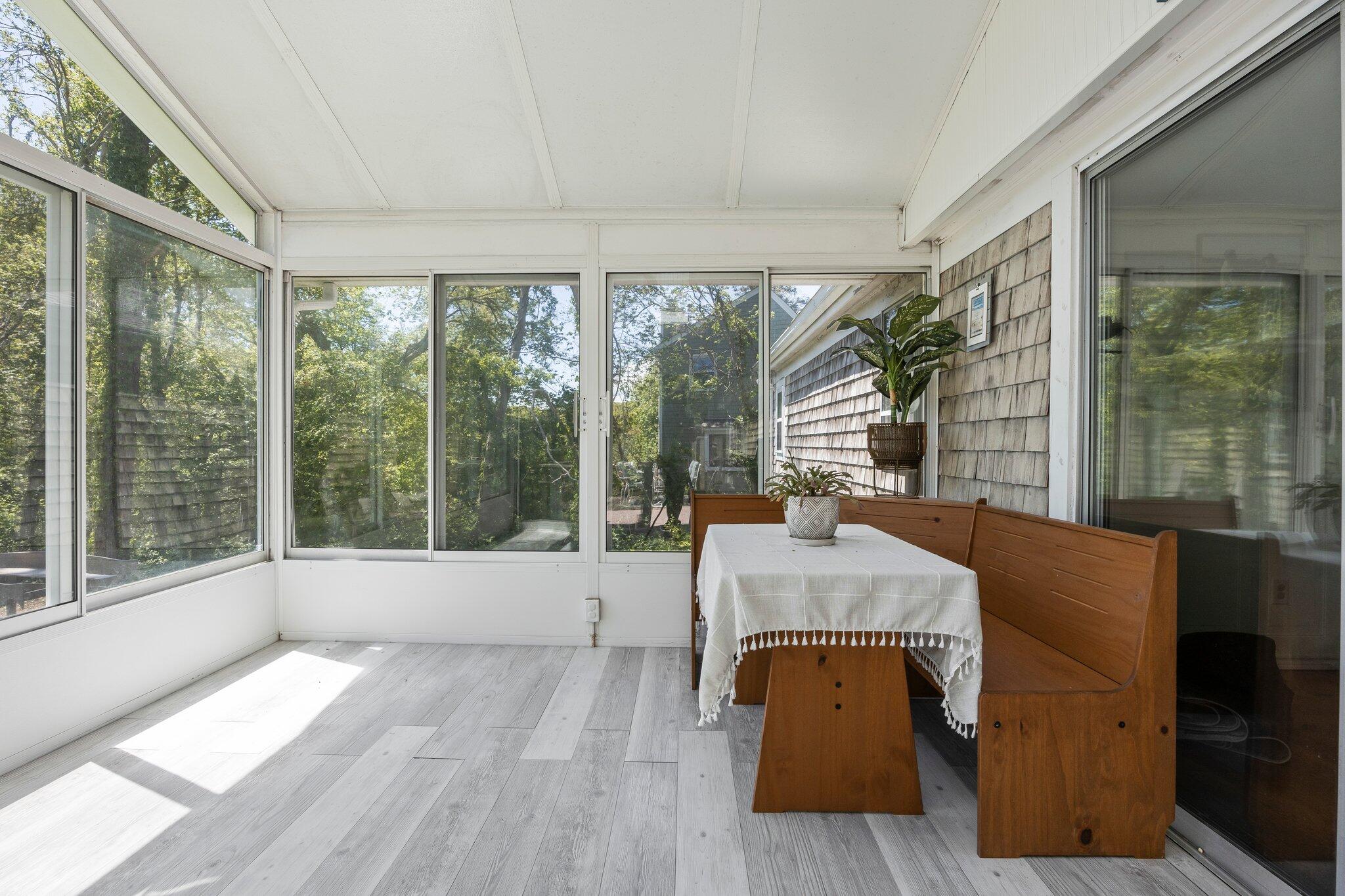 91 Sterling Road Hyannis, MA 02601 - Photo 18 of 31 a dining room with furniture and large windows