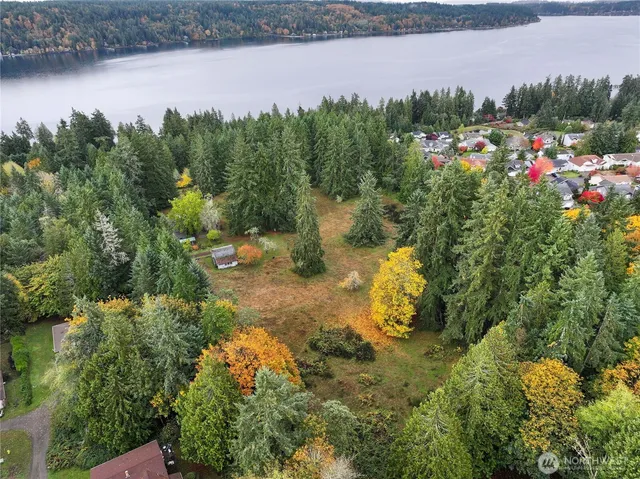 a view of a lake with a house in the background