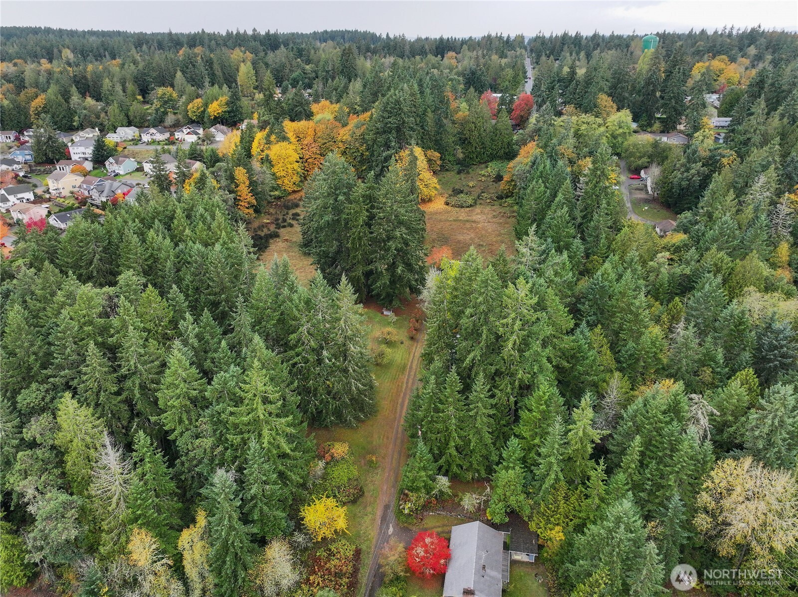 6371 Illahee Road Northeast Bremerton, WA 98311 - Photo 6 of 10 an aerial view of residential house with outdoor space and trees all around