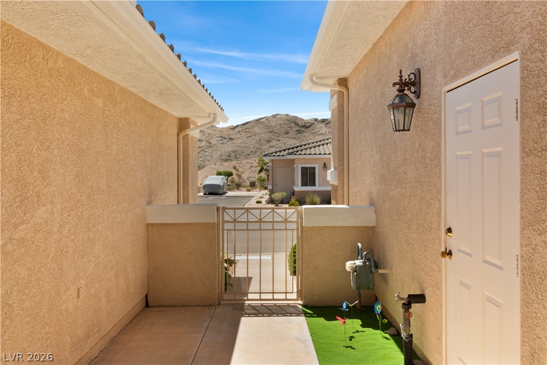 3376 Partridge Run Street Laughlin, NV 89029 - Photo 54 of 92 A private gated entryway leads to a mountain view, enhancing this home's curb appeal.