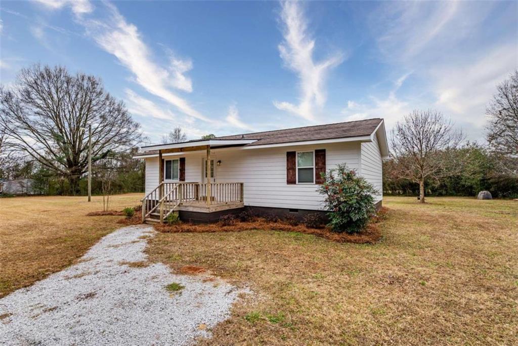 1181 Glades Road Madison, GA 30650 - Photo 1 of 1 a view of a house with backyard and sitting area
