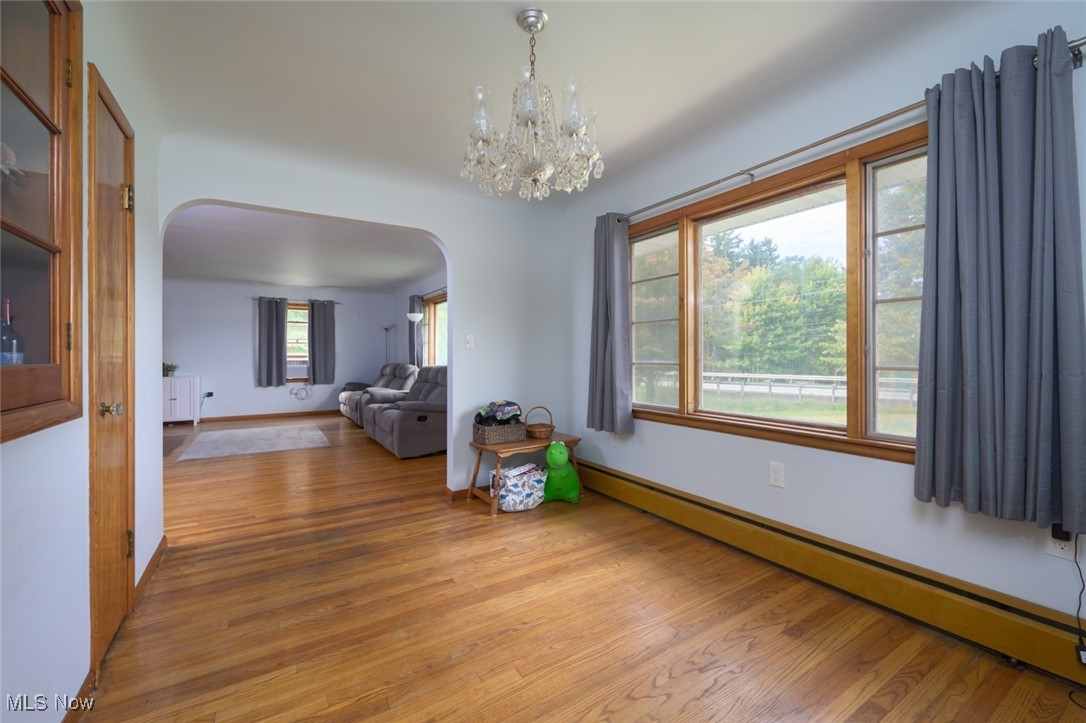 3738 South Ridge Road East Ashtabula, OH 44004 - Photo 24 of 41 Dining room hardwood floor & large window