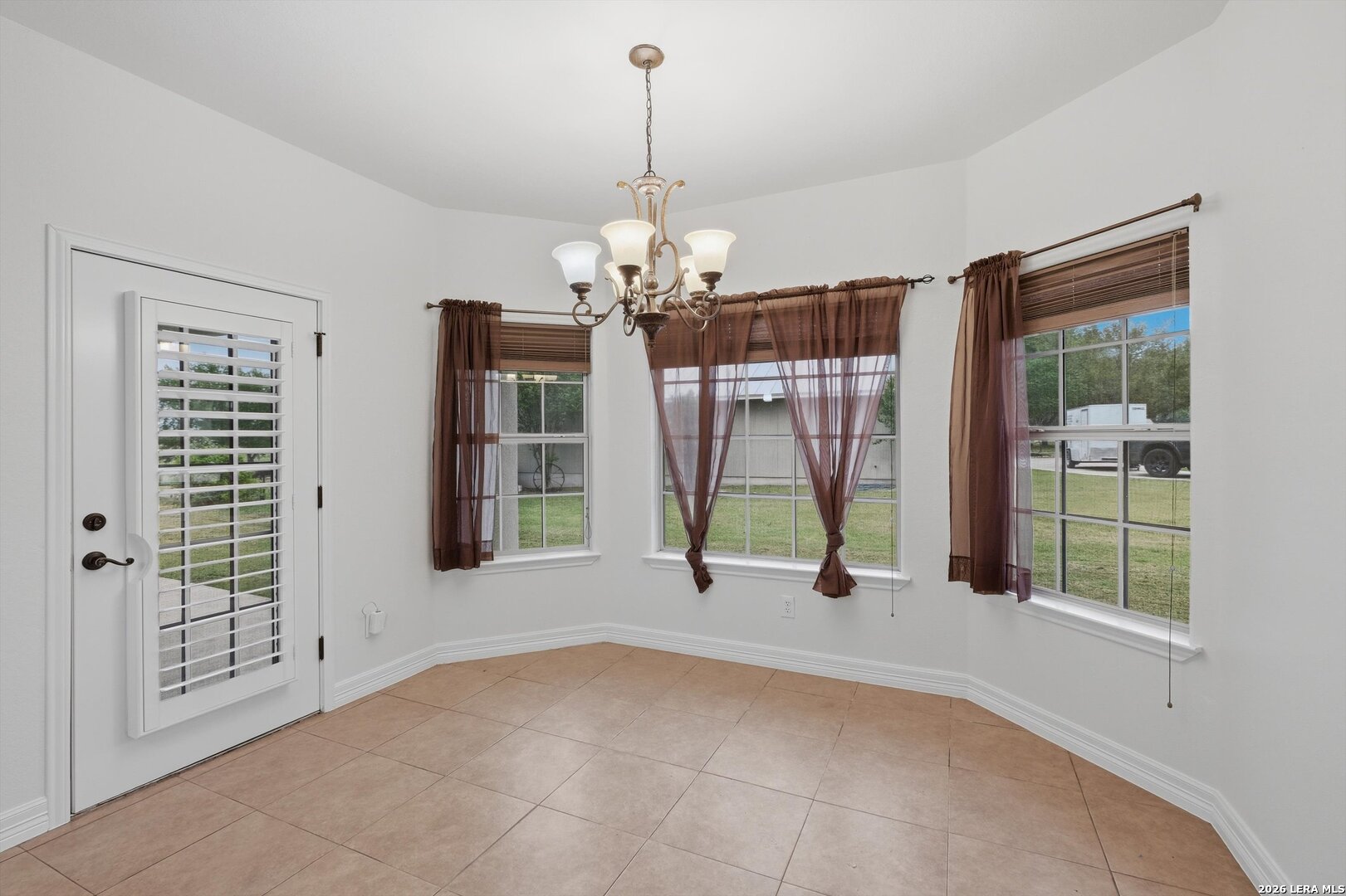 101 Lynx Circle Devine, TX 78016 - Photo 16 of 36 a view of a room with windows and entryway