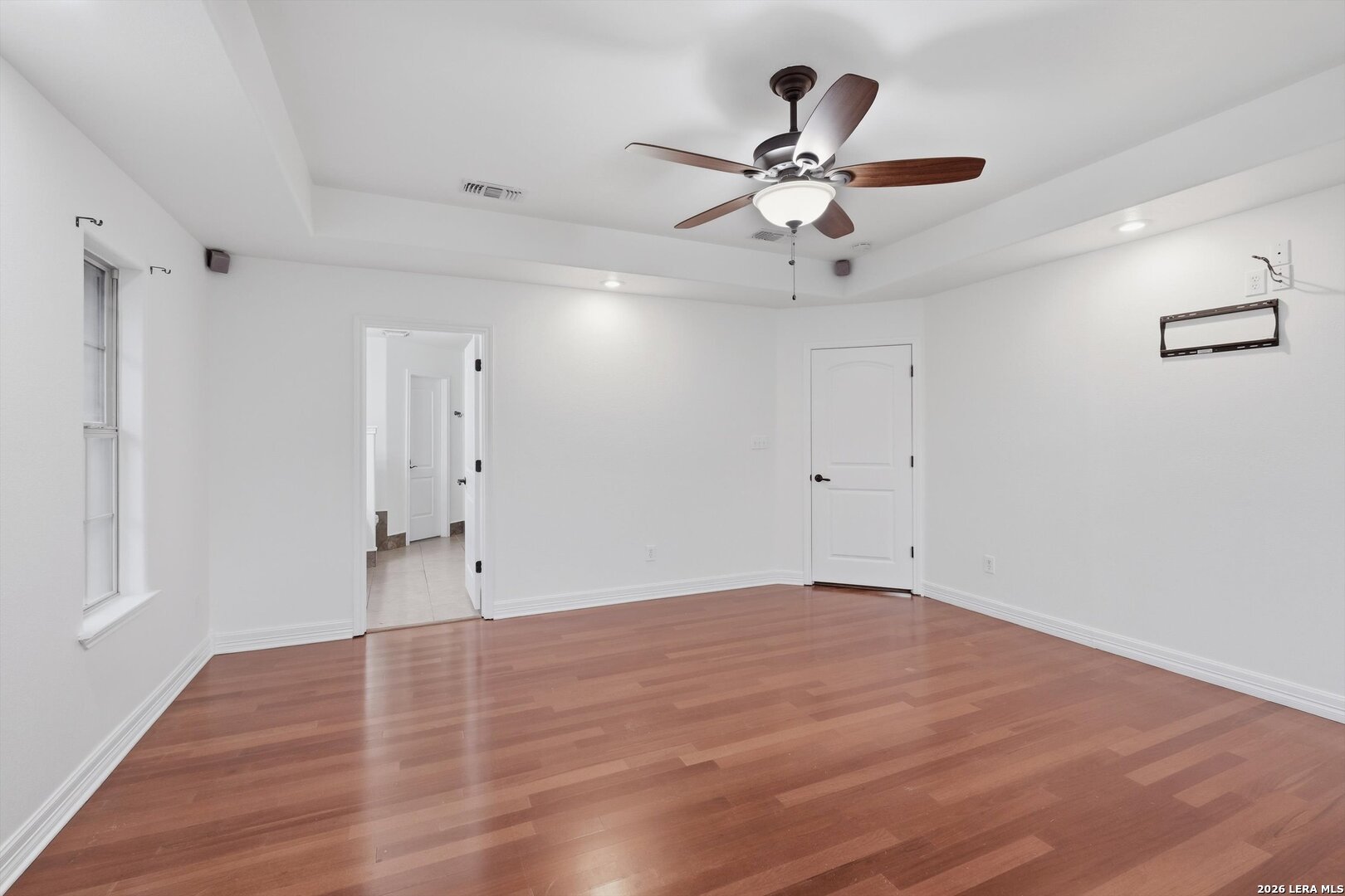 101 Lynx Circle Devine, TX 78016 - Photo 22 of 36 a view of an empty room with wooden floor
