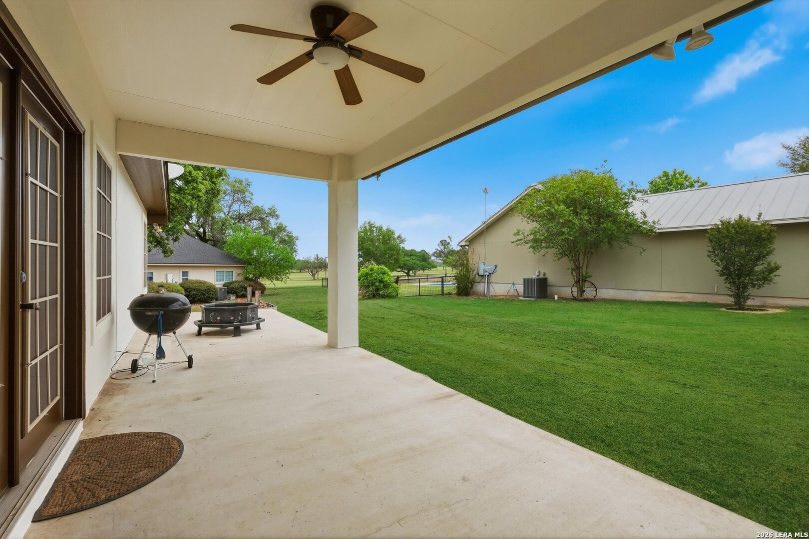101 Lynx Circle Devine, TX 78016 - Photo 27 of 36 a view of a porch with furniture and a yard