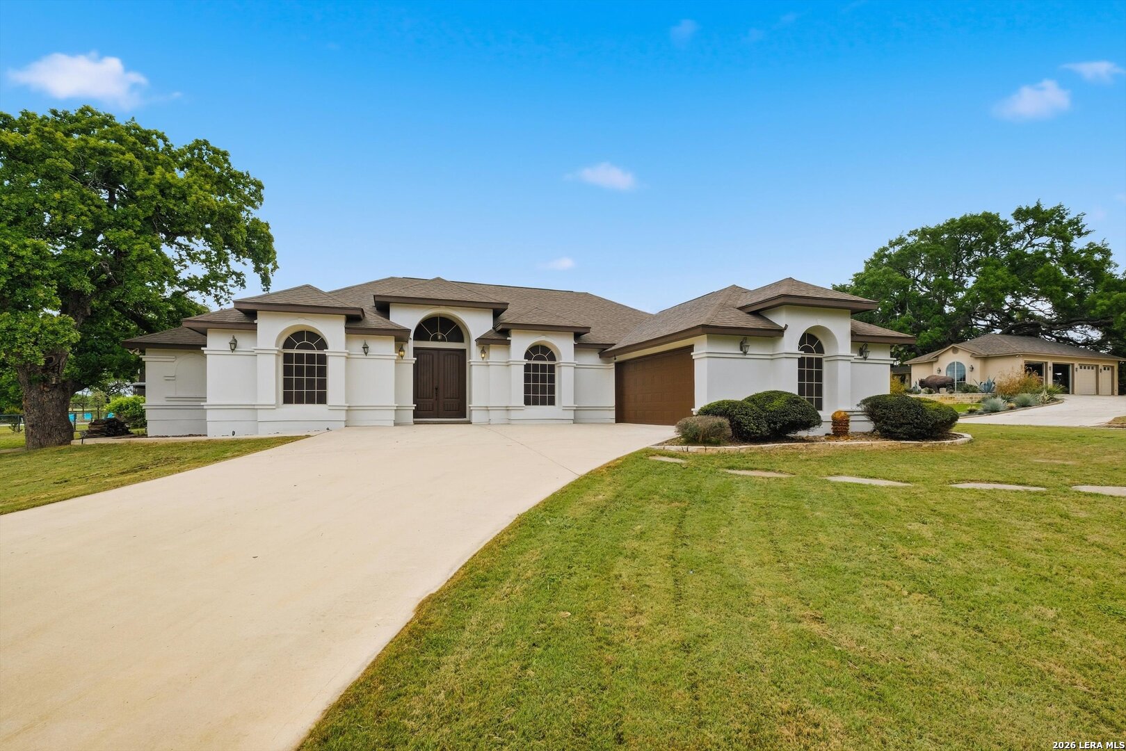 101 Lynx Circle Devine, TX 78016 - Photo 32 of 36 a front view of a house with a yard